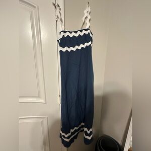 Mid calf blue dress with white accents on the bottom and the top